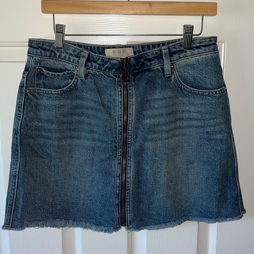 New Free People zip front denim skirt, size large.